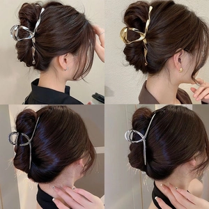 Elegant gold and silver metal butterfly hair claw clips for women with wavy line design