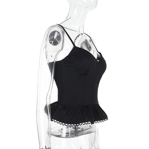 Side view detail of black camisole top with ruffled hem and hollow lace trim decoration