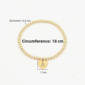 Detail showing 18cm gold beaded letter A heart bracelet with 0.4cm bead size