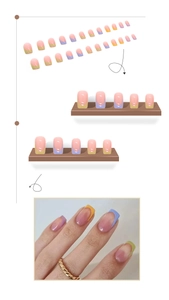 Detail view of colorful French tip press on nails with lavender and green square tips