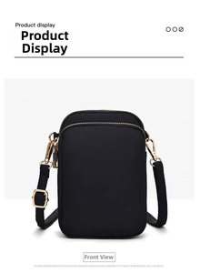 Detailed front view of black nylon phone bag with three gold zipper compartments