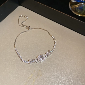 Detailed view of silver butterfly bracelet with clear zircons and adjustable bolero clasp