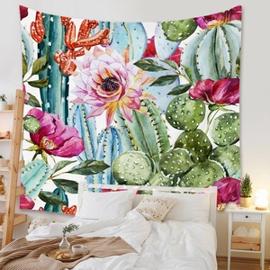 Detail of bohemian tapestry featuring watercolor cactus and floral patterns on white fabric