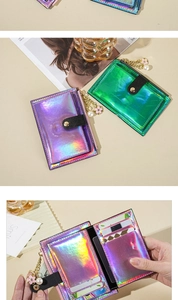 Close-up of holographic card holder featuring a pearl flower charm and snap button closure
