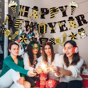 Black and gold Happy New Year party decoration set with glitter banners and cake toppers