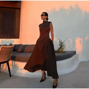 Elegant dark brown high-neck sleeveless maxi dress with buckle detail and flowing hemline