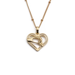 Golden heart pendant necklace with small diamonds featuring a hand-holding design