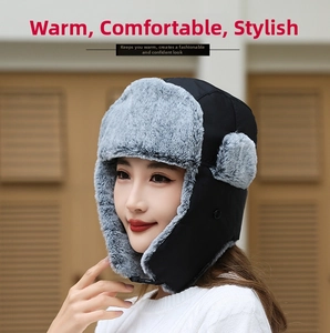 Detail of winter trapper hat featuring windproof nylon and thick gray faux fur lining