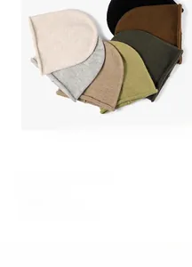 Close-up of soft knitted textures and a diverse color palette for winter beanies