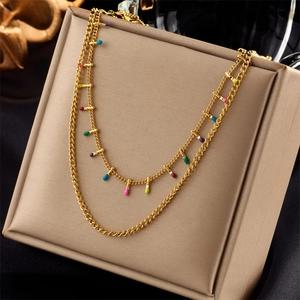 Double-layer gold necklace with colorful enamel charms on a minimalist titanium steel chain