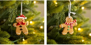 Detailed view of gingerbread ornaments on a Christmas tree with size and weight specs
