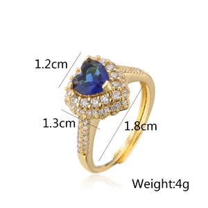 Detailed view of heart-shaped blue gemstone ring with 18K gold plating and dimensions