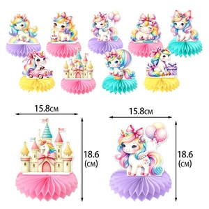 Unicorn and castle themed party centerpieces with honeycomb bases for birthday decor