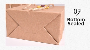 Detail of reinforced glued bottom on brown kraft paper gift bag with sunflower decor