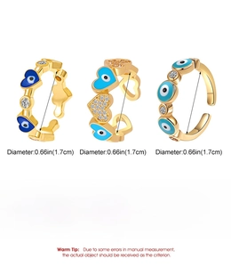 Detailed view of the 14k gold plated evil eye rings with blue enamel and zircon inlay