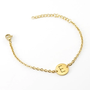 Minimalist 18K gold plated stainless steel bracelet featuring a round letter E pendant