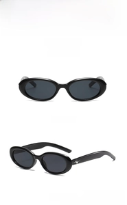 Detail of oval black sunglasses with silver star metal ornaments on the temple arm