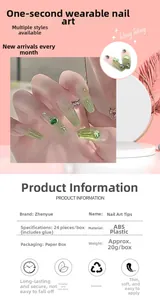 Detail view showing green gradient press-on nails with 3D hearts and rhinestones decoration
