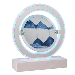 Creative LED sand art table lamp with blue mountains and stylish circular light frame