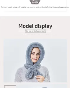 Close-up of plush hooded scarf with white polka dots and secure snap button closure