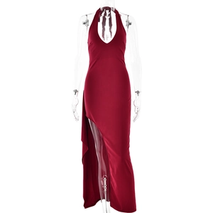 Detail view of red halter neck dress with deep V-neck and high side slit design