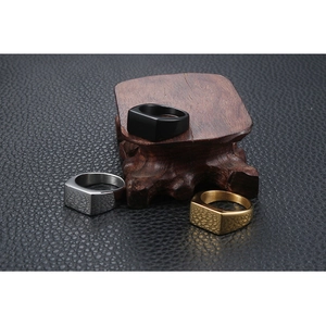 Polished rectangular signet rings in black, gold, and silver stainless steel finishes