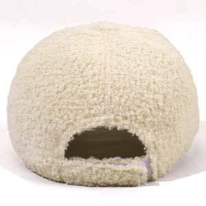 Back view of cream sherpa baseball cap featuring adjustable strap and fuzzy teddy texture