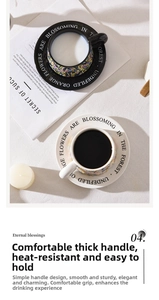 Detailed top view of ceramic coffee cup with floral pattern saucer and thick handle