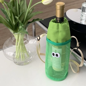 Green mesh crossbody water bottle bag with cartoon eyes and adjustable strap