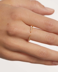 Close-up of a s925 silver open ring with white zircon on a hand in minimalist style