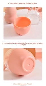 Detail of pink makeup sponge case with portable silicone handle and anti-slip base
