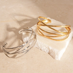 Minimalist multi-layer crossed geometric open bracelets in gold and silver finish