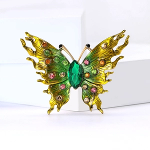 Exquisite enamel butterfly brooch with colorful crystals on a white geometric base