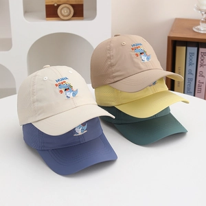 Pile of kids dinosaur baseball caps with breathable mesh holes in five assorted colors