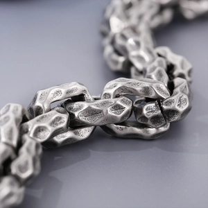 Macro shot of hip hop style stainless steel chain with antique silver finish textures