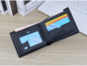 Close up of a sleek black bi fold men wallet with multiple card slots and clear ID window view.