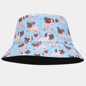 Detail of light blue bucket hat with cute cartoon pug and red heart print patterns