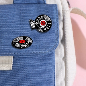 Retro rock vinyl record enamel pins set on a canvas bag for vintage music lovers