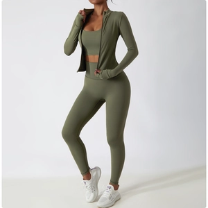 Detailed view of olive green zip-up sports jacket with thumb holes and high-neck design