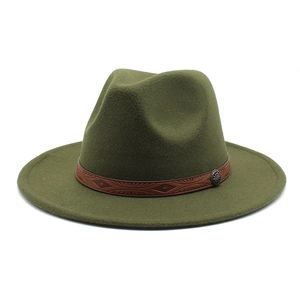 Close-up of a dark green wool fedora with an embossed brown ethnic style band and buckle