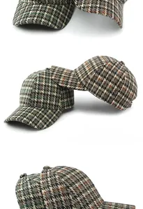Detail of vintage houndstooth baseball cap showing high-crown structure and fabric texture