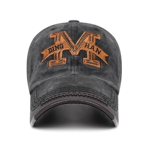 Washed dark gray cotton baseball cap with large brown M embroidery and DING HAN ribbon