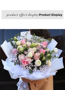 Detailed view of pink roses bouquet wrapped in layered white floral tissue paper