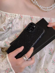 Sparkling black glitter phone case with vertical stripes on elegant model hand