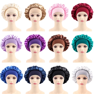 Detail view of wide-band satin sleep bonnets in twelve different vibrant glossy colors