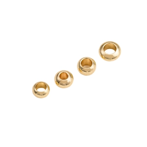 Polished 14K gold filled spacer beads set in different sizes on white background