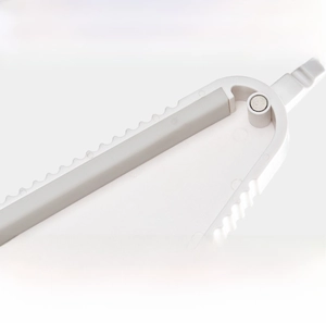 Detail of multi-functional opener with rubber anti-slip strips and serrated edges