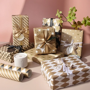 Elegant gold and cream gift wrapping paper rolls with striped and geometric patterns