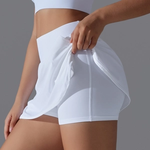 Detail view of white high-waisted tennis skort featuring a built-in security liner