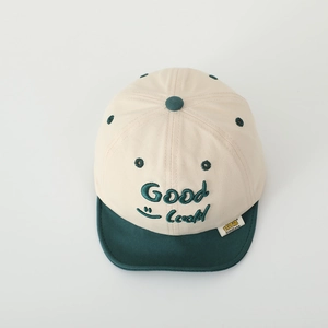Detailed embroidery of Good Luck text and smile face on child's contrast baseball cap